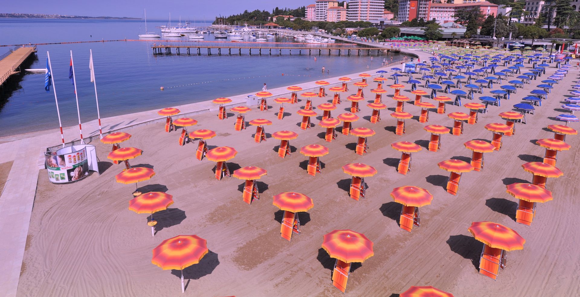 Portoroz beach Piran Slovenia Colorful umbrellas on sandy beach