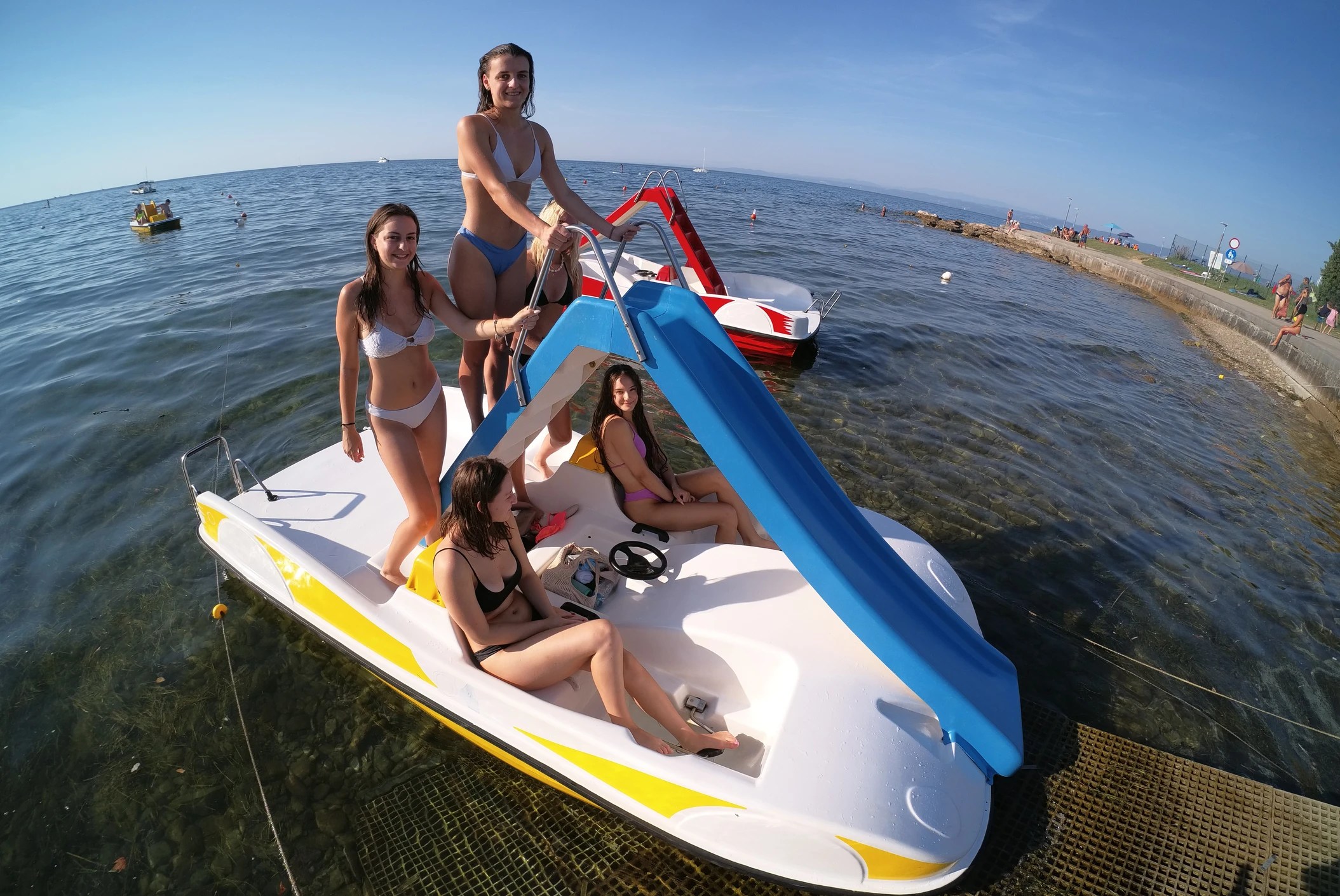 Group enjoying a sunny water activity on the beach of Piran Slovenia